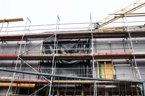 istock scaffolding at a construction site,  construction site of modern apartment building 2058902406