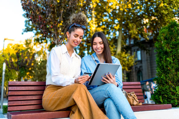 istock Female friends using tablet for online shopping 2058906117