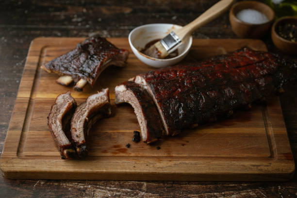 istock sliced barbeque spare ribs on wooden board 2058928920