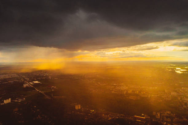 rain cloud drone photography. cumulonimbus. sustainability. dramatic sky. - dramatic sky dusk night sustainable resources photos et images de collection