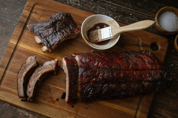 istock sliced barbeque spare ribs on wooden board 2058932098