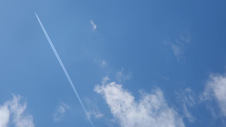 Airplane flying on deep cloudy blue sky