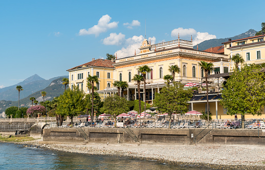 Bellaggio, Lombardy, Italy - September 5, 2022: View of the Luxury Grand Hotel Villa Serbelloni with swimming pool on the shore of lake Como.