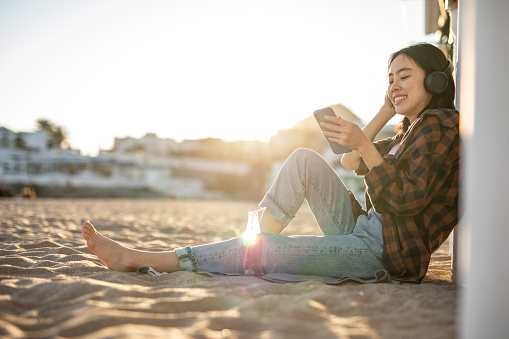 Playa de Garraf, One woman, Japanese, young woman enjoying at Garrafu beach in Spain, enjoying a nice spring day