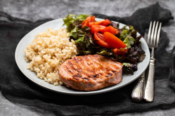 istock grilled cutlets burger with boiled rice and salad 2059034103