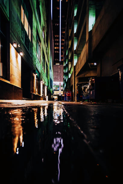 istock Dark alley reflected in puddle - Dallas 2059040037