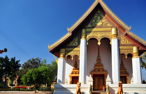 Vientiane, Laos: Wat That Luang Tai, temple on That Luang Park, Pha That Luang complex, Ban Thatluang - Ornate façade of the Ordination hall guarded by lions and nagas. Heritage of the Lane Xang Kingdom, four temples used to surround the That Luang stupa, now only Wat That Luang Tai  and Wat That Luang Neua survive.