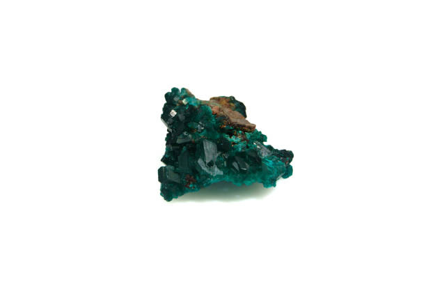 istock natural green dioptase rough gem on the background 2059080293