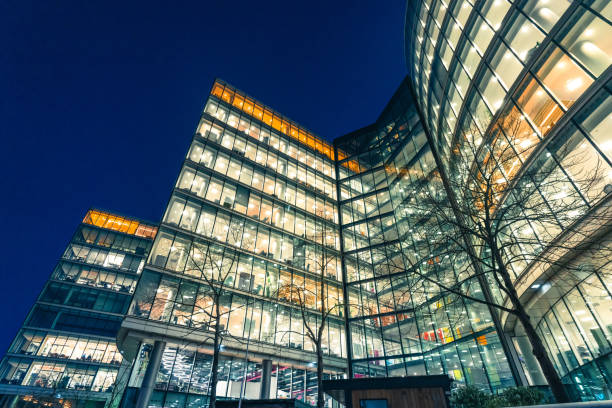istock Illuminated office buildings in London at Night 2059112383