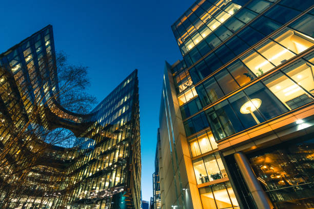 istock Illuminated office buildings in London at Night 2059112905
