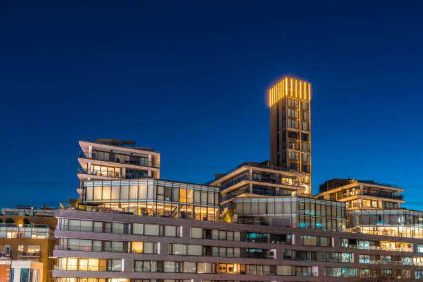 A modern residential building facade at night