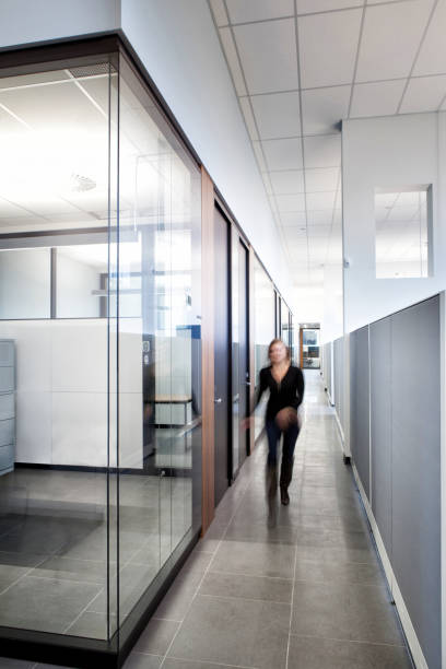 istock Woman Blurry Walk in a Business Office 2059123888