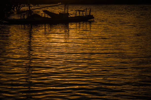 Sunset and boats on the beach