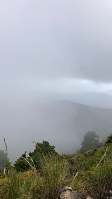 Panoramic view from hiking trail to Maroma peak in thunderstorm day