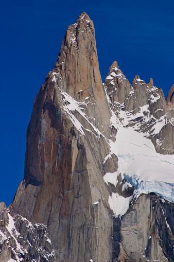 Cerro Poincenot stands tall, cloaked in pristine snow, epitomizing Patagonia's rugged beauty