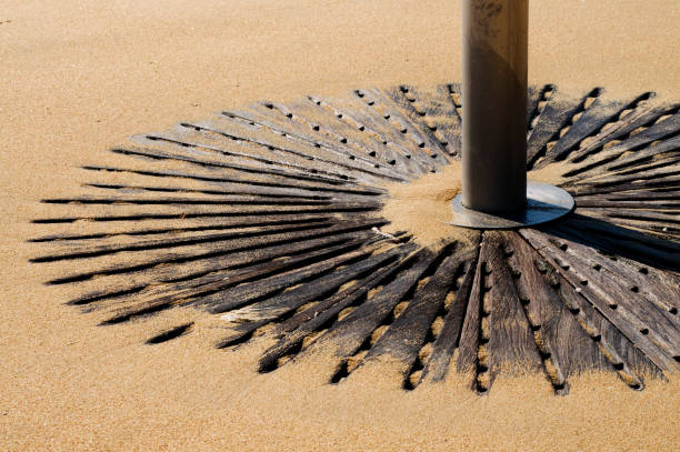 Sand-covered beach shower base in Barcelona, Spain