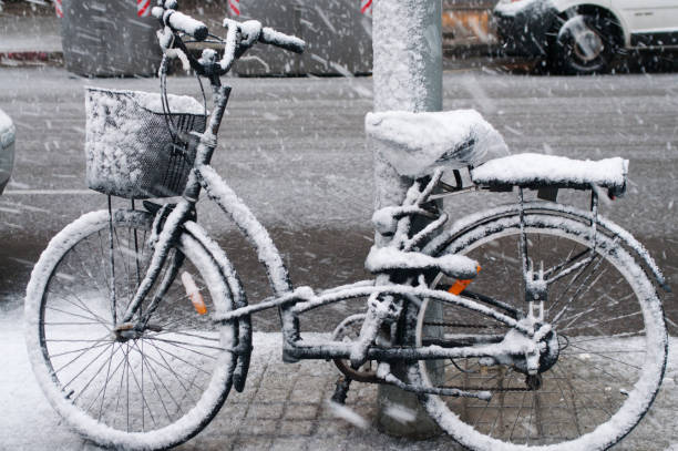 istock Snowy Barcelona: Bicycle Parked on Snow-Covered City Street 2059189210