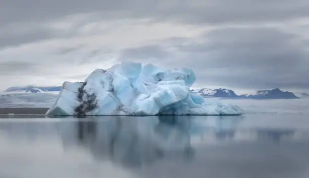 Iceberg floating in the Jokulsarlon glacier lagoon lake at the edge of Vatnajokull National Park in south Iceland