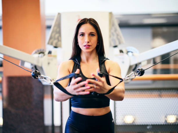 istock Young Woman Strength Training in a Gym 2059214714