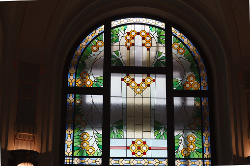 Paris, France: Antique Windows with Red Stained Glass Close-Up