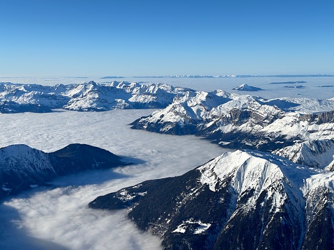 A photo of the Aiguille du Midi mountain peak, near to Chamonix in the French Alps. There is a cloud inversion meaning the cloud is sitting in the Valley.