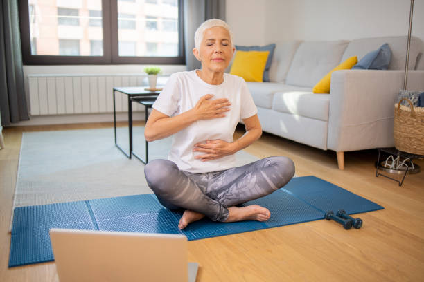 istock Senior woman at home keeping fit by exercising 2059317128