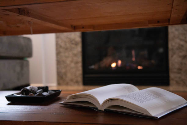 istock Looking underneath coffee table top at open book in a relaxed, luxury living room scene 2059335678