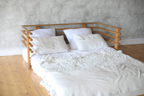 istock Interior of light room with big bed 2059393638