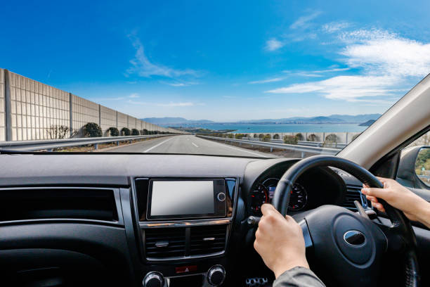 istock A person who drives a car while looking at the beautiful scenery outside 2059427258