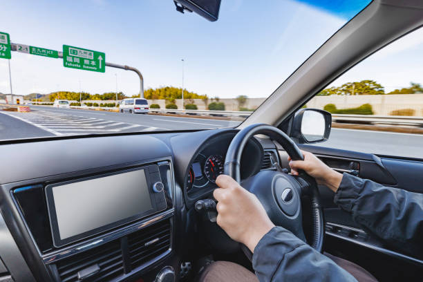 istock A person who drives a car while looking at the beautiful scenery outside 2059438178