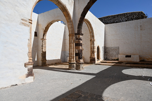 Betancuria, Fuerteventura, Spain, February 27, 2024 - The ruins of the former Franciscan monastery Convento de San Buenaventura in Betancuria, Fuerteventura.