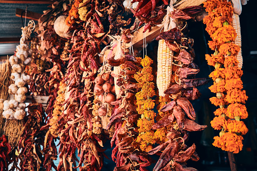 Bundles of dried flowers of Imeretian saffron, onions, spicy peppers and garlic