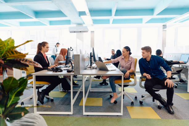 istock Collaborative process of multicultural skilled young business team during brainstorming meeting in office.Diverse group of young people dressed in formal wear cooperating on developing design project 2059567860