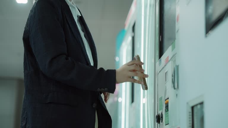 Woman pays contactless at a food vending machine