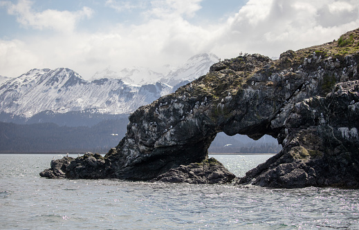 Heart shaped rock arch near Gull Island in Kachemak Bay near Homer in Alaska United States