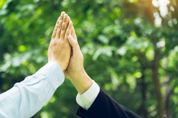 istock Group of volunteer people joining for cooperation about global community teamwork with join hand together, World environment day, sustainable development goal. 2059584440