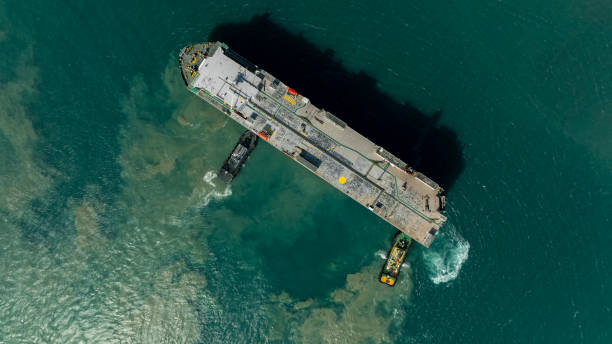 istock Aerial top view Tugboat pushing dragging Large RoRo (Roll on Roll off) in sea. 2059587066