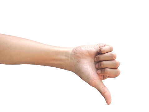 Male hands making a dislike gesture isolated on white background.