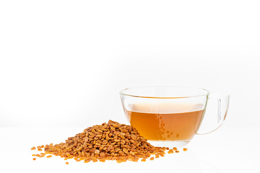 Indian drink masala tea with milk and spices. Cardamom sticks cinnamon star anise cane sugar