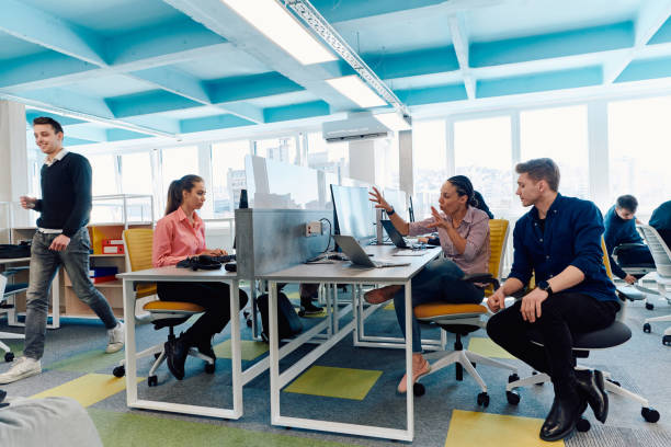 istock Collaborative process of multicultural skilled young business team during brainstorming meeting in office.Diverse group of young people dressed in formal wear cooperating on developing design project 2059643321
