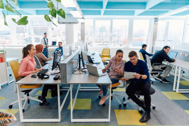 istock Collaborative process of multicultural skilled young business team during brainstorming meeting in office.Diverse group of young people dressed in formal wear cooperating on developing design project 2059658910