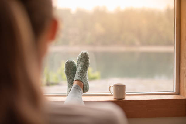 istock Woman relaxing and looking out the window. 2059684293