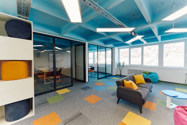 istock Photo of a modern office where programming, digital marketing and web design projects are done. Office with modern furniture and glass office 2059692737