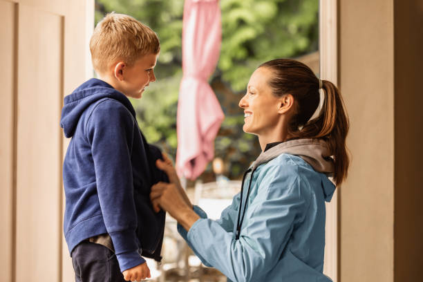 istock Mother helping get ready her son for school. 2059713618