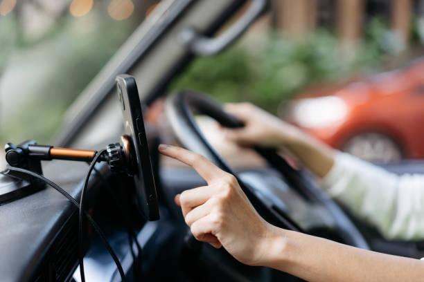 istock Delivery woman navigating with smartphone in van 2059751145