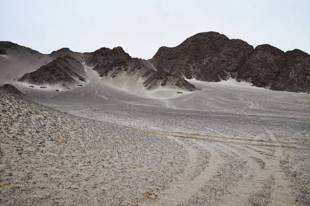Heidushan Mountain is located in Mangya in Qinghai, China. The surface of the mountain is black rock, which is actually  black gobi desert. It is also a place that looks very much like the moon. The Heidushan Mountain in photography presents the characteristics of Chinese ink painting.