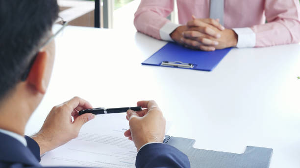 istock Job Interview with headhunter agent and applicant. Job HR applicants having an interview with Human resource manager jobs interviewing with confident candidate at business firm office give cv resume 2059783698