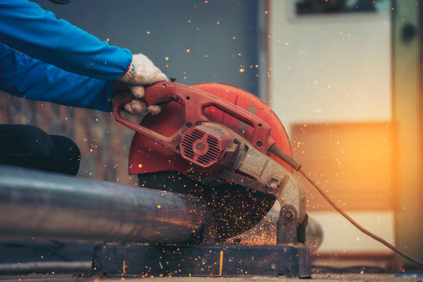 istock Men hands wear protective glove Hot flame metal work cutting fire iron workshop. Locksmith use Welding machine cut metal process. Construction Worker hands using Welding machinery iron metal sparking 2059790291