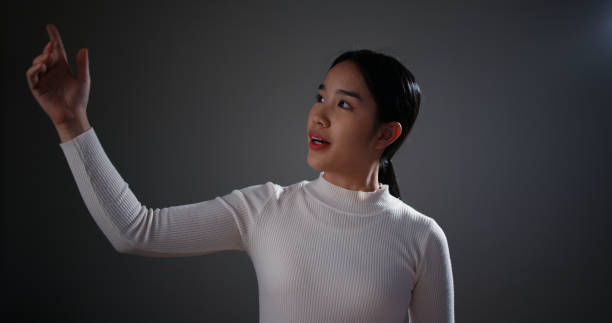 istock Young woman is presenting a business plan on stage. 2059806789