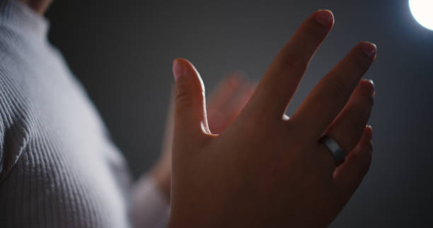 Selective focus, Hands of Female motivational speaker on stage talking and showing a presentation to audience, Startup conference, Business and entrepreneurship event, Talking about success and mindset